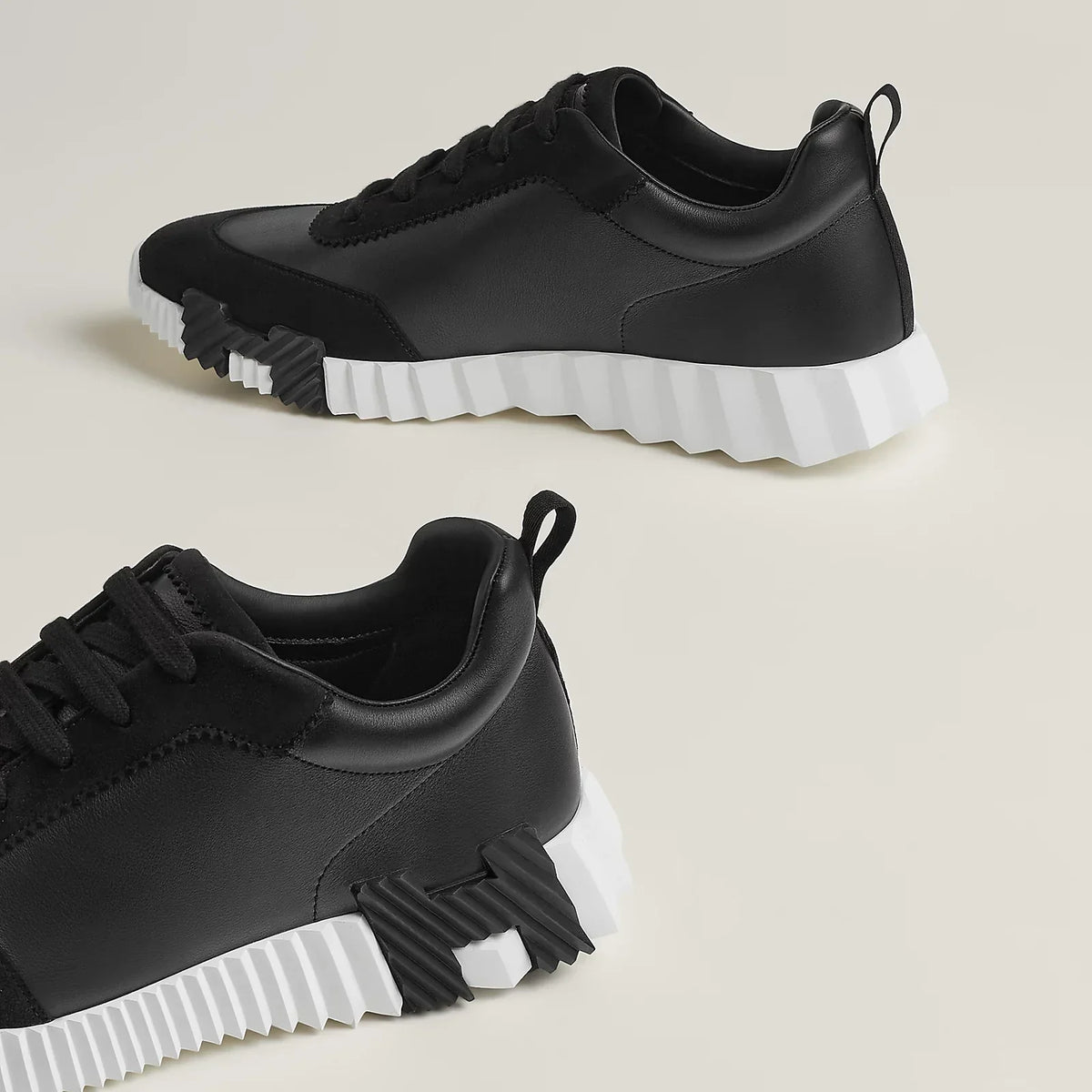 HERMÈS SNEAKER BOUNCING – NOIR ET BLANC CUIR